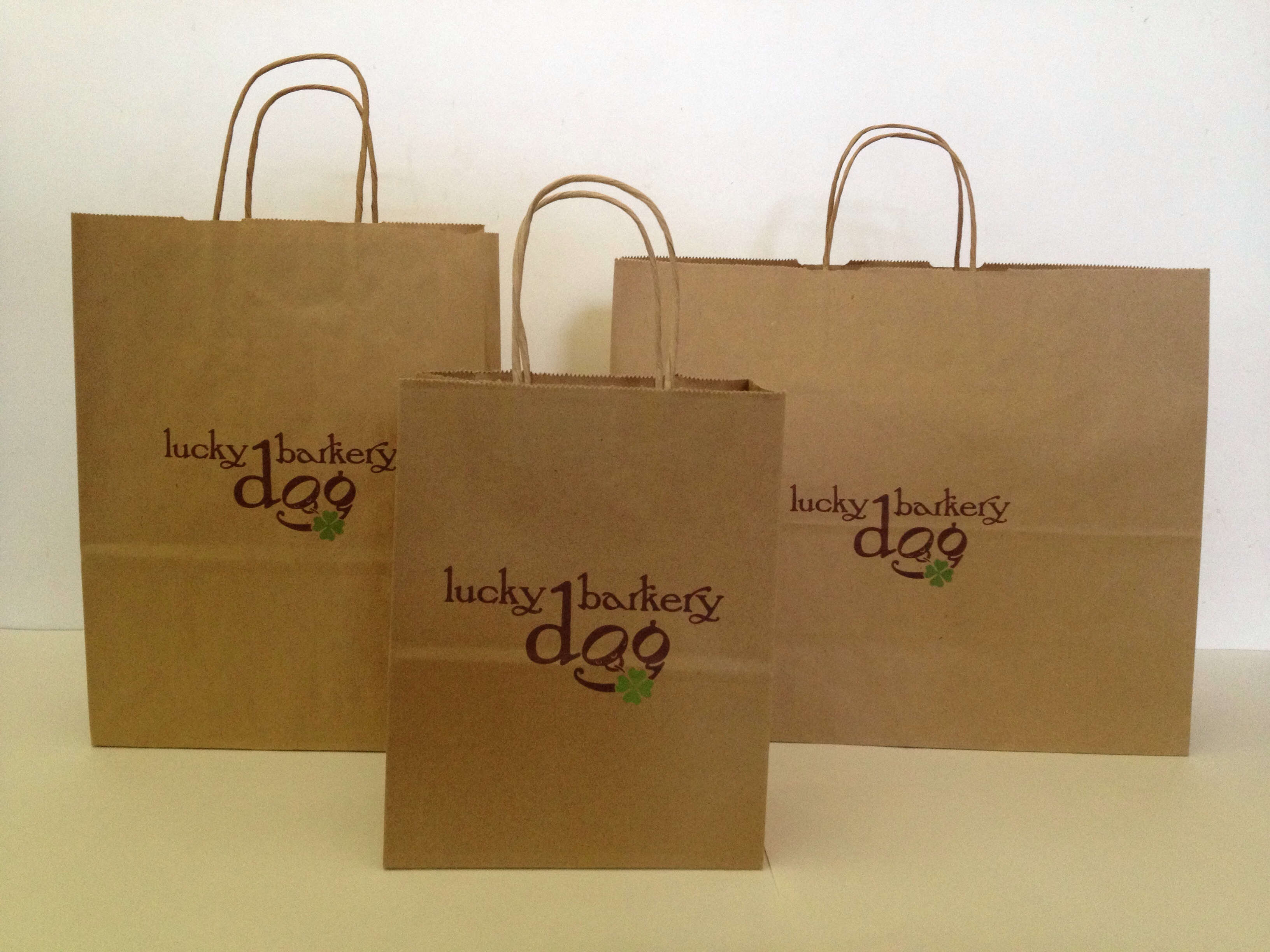 Lucky Dog Barkery-natural kraft paper shoppers-hot stamped 1 color matte green/ink print 1 color brown